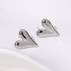 Minimalist silver heart stud earrings with polished 18K gold plated stainless steel finish