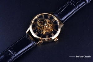 Detailed close-up of a men's mechanical watch with a skeleton dial and gold steel case