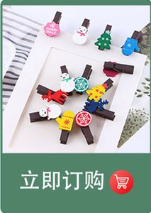 Macro detail of Christmas themed wooden mini clips with festive snowman and tree designs