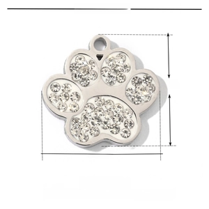 Macro view of 13mm stainless steel dog paw pendant with sparkling crystal inlay