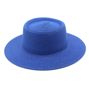 Royal blue flat top straw boater hat with dense woven texture for summer beach sun protection