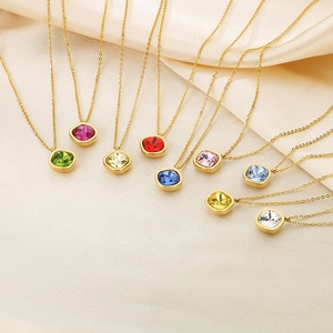 Detail of colorful cushion cut zircon pendants on 18k gold plated stainless steel necklaces