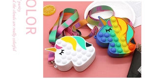 Detail of unicorn fidget shoulder bags with colorful adjustable straps and pop bubbles