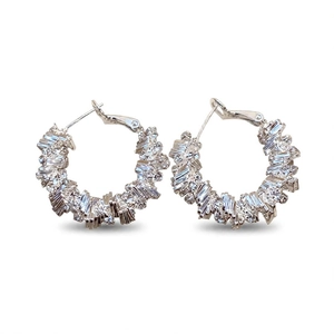 Irregular geometric hoop earrings with baguette-cut rhinestones in silver finish