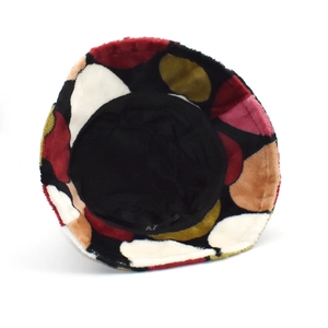 Plush bucket hat with colorful polka dots in soft coral fleece for winter warmth