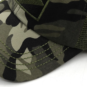 Macro detail of camouflage baseball cap with stitching on brim and mesh paneling