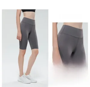 Detail view of high-waisted gray yoga shorts showing tight seams and tummy control fit