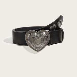 Black leather belt featuring a large vintage silver heart buckle and metal studs
