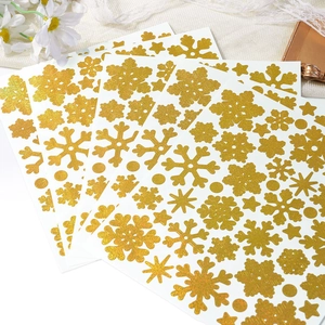 Detailed view of glitter gold snowflake stickers for Christmas DIY cards and gift bags