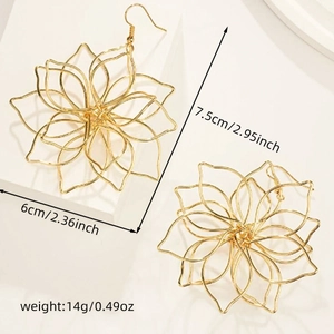 Detail view of woven gold flower earrings with dimensions 7.5cm by 6cm and 14g weight