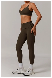 Detail of olive green yoga set showing ergonomic fit and stretch of v-neck top and leggings