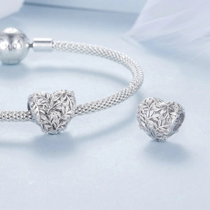 Hollow heart leaf charm made of S925 sterling silver on a mesh bracelet