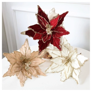 Detailed texture of velvet poinsettia flowers with glitter edges for Christmas tree decor