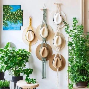 Bohemian handmade macrame hat organizer wall hanging in yellow green and white