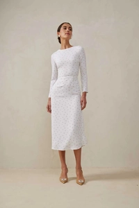 Full view of white floral long sleeve midi dress with cinched waist and vintage pattern