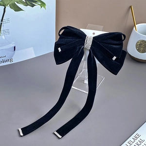 Elegant black velvet bow hair clip with sparkling rhinestone tassels and long ribbons