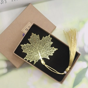 Elegant gold maple leaf brass bookmark with tassel in a black velvet gift box