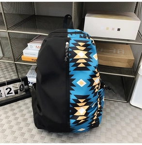 Detail of multi-color geometric ethnic pattern on black nylon laptop backpack