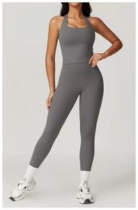 Close-up of grey high-stretch fitness set featuring a racerback tank top and yoga leggings