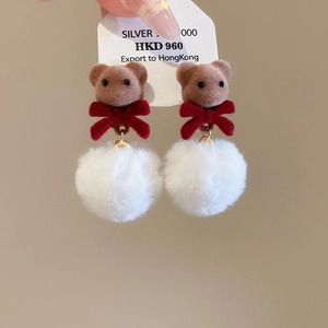 Detail of flocking bear earring with red bow, plush white ball, and S925 silver stamp