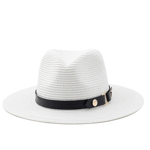 Detailed view of the woven white Panama straw hat with black leather band and gold stud