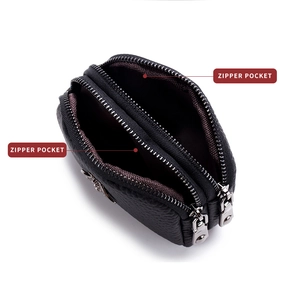 Detail view of double zipper pockets on black pebble leather coin purse for small items