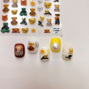 Detail of embossed 3D bear nail stickers featuring colorful cartoon patterns and art samples