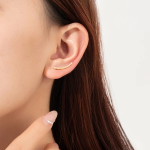 Elegant 925 sterling silver gold ear climber with cubic zirconia on female model