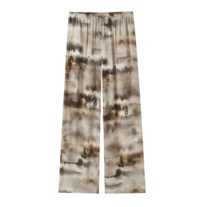 Close-up of marble tie-dye wide-leg trousers with drawstring elastic waistband