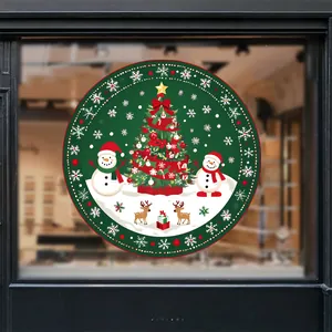 Close-up of a circular Christmas window sticker with tree, snowman and reindeer on glass