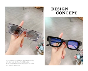 Close-up of retro square sunglasses in black and grey frames with polar lenses