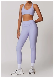 Detail of high-waist light purple yoga leggings and U-neck sports bra set in macro view