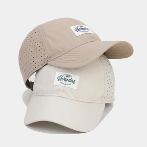 Detail of laser-cut breathable holes on quick-dry baseball caps for outdoor summer sports