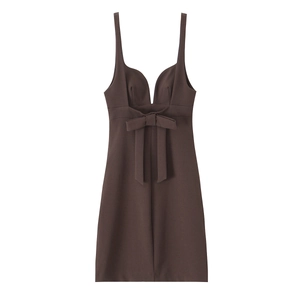 Detail of a dark brown mini dress featuring a deep V-neckline and a front bow decoration