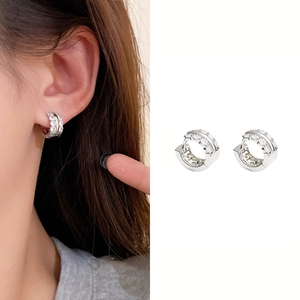 Detailed view of silver hoop earrings featuring double-row clear cubic zirconia stones