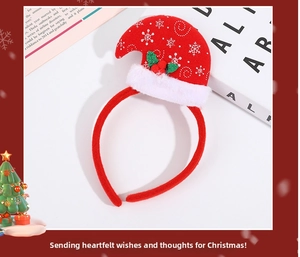 Detail of red Christmas headband featuring a mini Santa hat with white snowflake patterns
