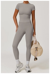 Full view of women's gray brushed yoga set with high waist leggings and short sleeve top