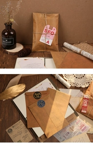 Close-up of vintage kraft paper envelopes and retro stationery accessories on wood background