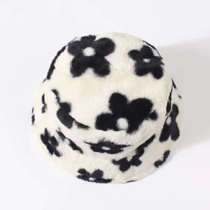 Close-up of the thick plush texture and black and white flower pattern on the bucket hat