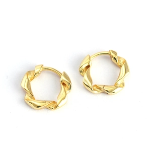 Minimalist golden twisted hoop earrings with elegant metal spiral design for women