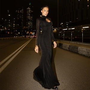 Close-up of elegant black high neck fishtail dress with cutout chest and shimmer fabric
