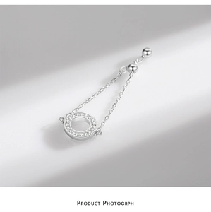 Macro detail of silver S925 ring with pavé cubic zirconia and adjustable chain