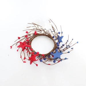 Detail of USA Independence Day candle ring with red white blue berries and wooden stars