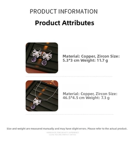 Detail view of purple zircon bow necklace and earrings set in a black jewelry box