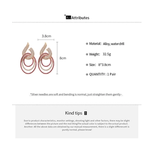 Detailed dimensions of hollow geometric dangle earrings with pink rhinestones and silver needles