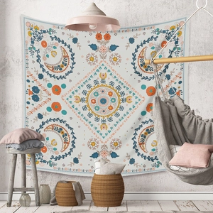 Bohemian mandala tapestry with floral patterns styled in a cozy home setting decor