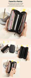 Detail showing brown and black long wallets with card slots and large capacity
