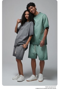 Retro washed grey and green oversized cotton T-shirt and drawstring shorts set on models