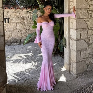 Detail of pink lace off-shoulder fishtail dress with elegant flared long sleeves