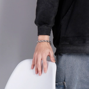 Classic silver Cuban link chain bracelet for men shown in a casual lifestyle setting